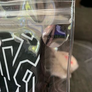 Victoria Secret phone case with card slot on back.